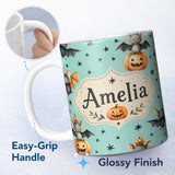 Personalized Custom Name Cute Halloween Bats Sitting on Pumpkins with Stars Teal Background 11oz Ceramic Coffee Tea Mug White Large Handle