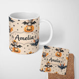 Personalized Custom Name Cute Halloween Bats Sitting on Pumpkins with Stars Beige Background 11oz Ceramic Coffee Tea Mug White Large Handle